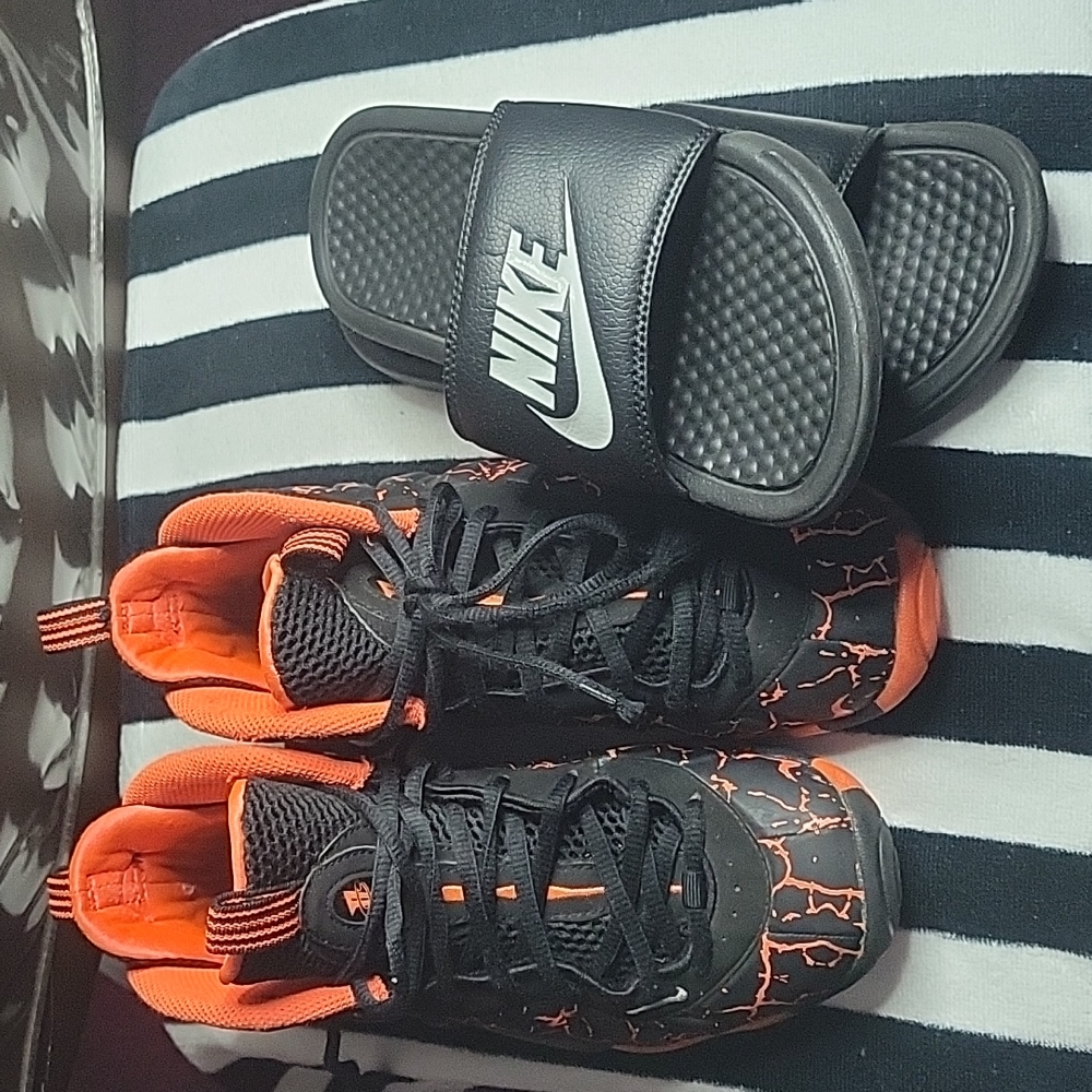 Nike foamposite size 4 orange and black Nike slides black and white size 5